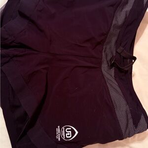 Ultimate Hydration running shorts with water bottles.
